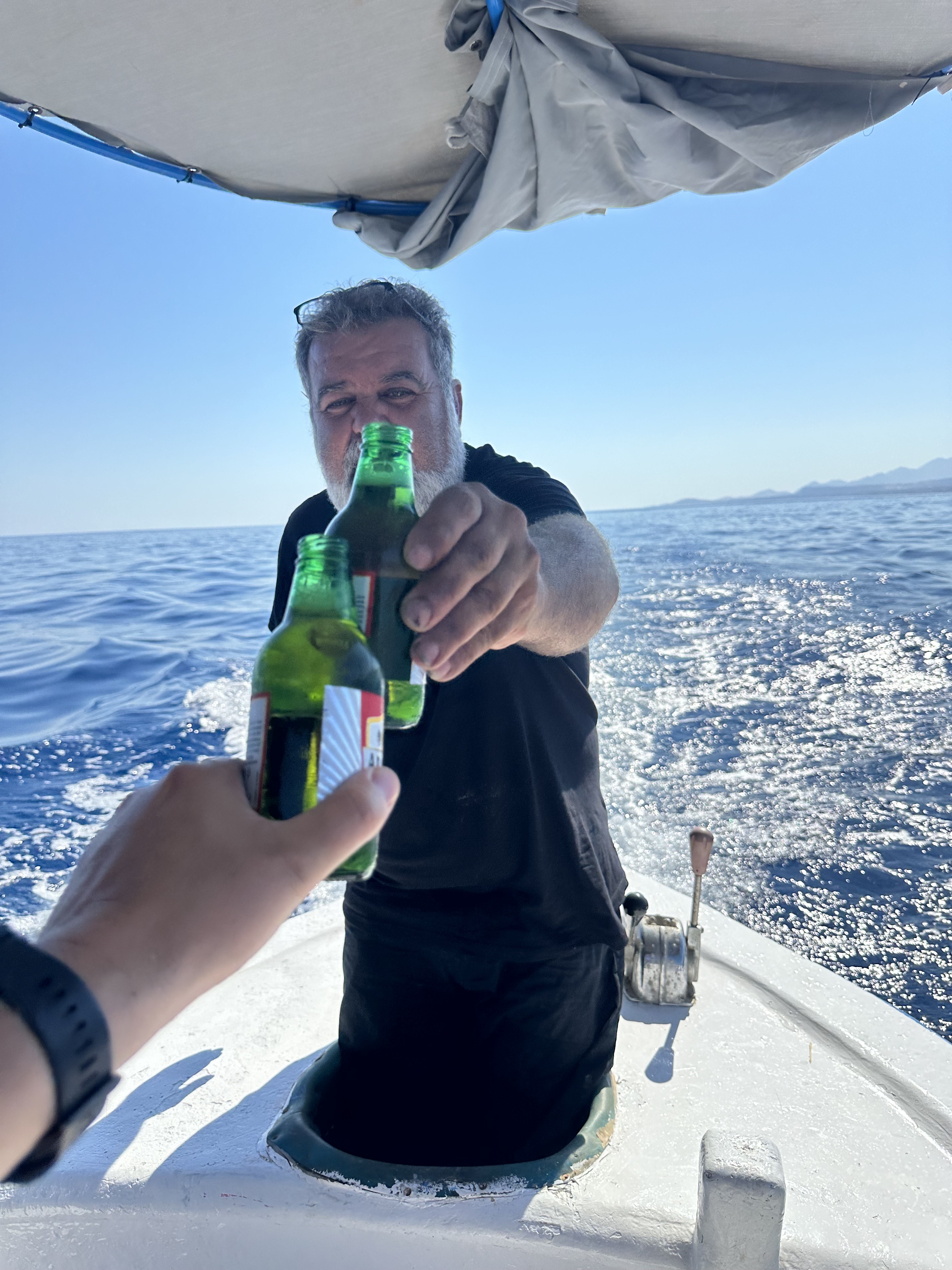 our crew drinking a cold beer on a wonderfulll fishing trip in the see of rethymno